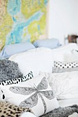 Cushions with dragonfly motif and various patterns on white couch