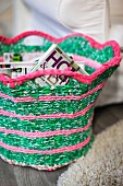Green and pink magazine basket