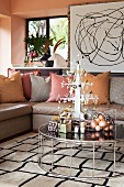 Living room in metallic shades with stylised metal Christmas tree on coffee table