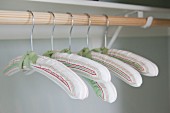 Close-up of hangers in cupboard