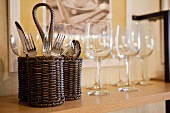Close-up of cutlery and wine glasses on shelf; San Marcos; California; USA