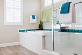 Bathtub and glass shower in bathroom; Azusa; California; USA