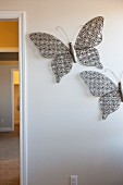 Metallic butterflies stuck on wall
