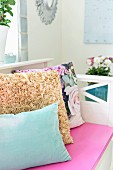 Scatter cushions on bench