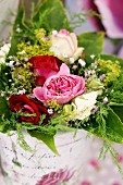 Bouquet with spray roses & gypsophila in vase with rose motif