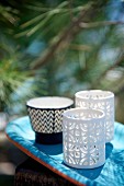 Bone china tealight holders with perforated patterns