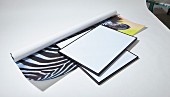 Rolled poster with zebra motif and picture frames