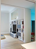 Private Apartment, London, United Kingdom. Architect: Hill Mitchell Berry, 2014. View of modern, custom-made shelving in living room