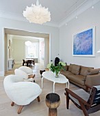 Private Apartment, London, United Kingdom. Architect: Hill Mitchell Berry, 2014. Extravagant armchairs with white, furry upholstery in living room