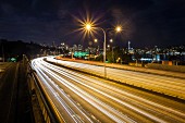 Long exposure of traffic on urban highway and city skyline at night, Seattle, Washington, United States