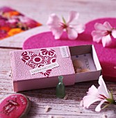 Matchbox painted and decorated with paper heart repurposed as surprise container
