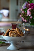 Chocolate-chip cookies in white china dish on set table