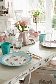 Table set with romantic pastel crockery
