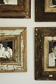 Detail of gallery of photographs with vintage wooden frames