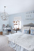 Romantic bedroom in pale blue and white with old-world ambiance