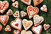 Heart-shaped gingerbread biscuits decorated with icing and sugar beads