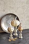 Painted pumpkins decorated with gold glitter
