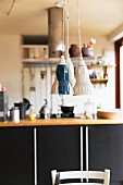 Three pendant lamps with retro lampshades above dining table