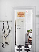 View of retro-style fridge-freezer through open door