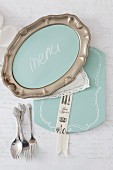 DIY menu board made from pewter platter and decorated place mat