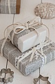 Gifts festively wrapped in newspaper and ribbons