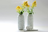 Vase covers crocheted from strips of fabric