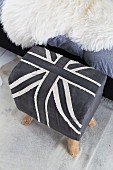 Stool upholstered in grey and white Union Flag