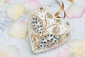 White heart pendant with gilt and rhinestone decorations