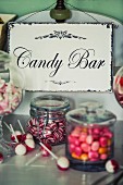 Candy buffet bar with vintage enamel sign