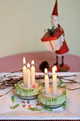 Festive candle holders made from glass bowls decorated with ruffled ribbons & beads