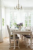 Set table in dining room with Gustavian-style furniture