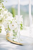 White posy and candles on outdoor wedding table (Ravello, Italy)