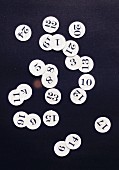 The numbers 1 to 24 written on paper discs for an advent calendar