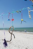 Flotsam hung from line on Prerow bean (Baltic Sea, Germany)