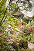 Summer house on a hill in landscaped garden