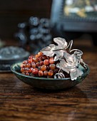 Bunch of gemstone grapes on an antique wooden table
