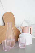 Chopping board, coffee pot, carafe and glasses in modern designs
