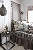 Comfortable daybed with upholstered headboard and valance