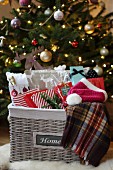 Basket of presents in front of Christmas tree