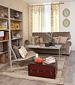 Vintage trunk, rug and open shelves in beige living room