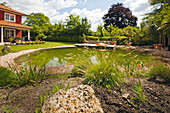 Natural-style swimming pond in garden
