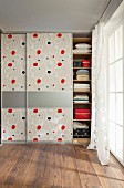 DIY wardrobes with floor-to-ceiling, patterned sliding doors