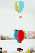 Mobile of hand-made colourful paper hot-air balloons