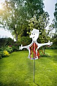 Hand-made scarecrow in garden