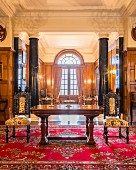Marble pillars and wood panelling in grand hall