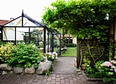 Greenhouse on paved courtyard