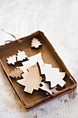 Cardboard box of wooden Christmas-tree decorations
