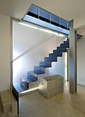 Folded steel staircase with neon lighting