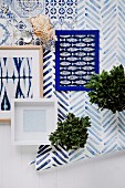 Pattern mix in blue and white colors on ceramic, paper and fabric with a maritime flair