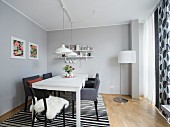 A modern dining room in black, grey and white